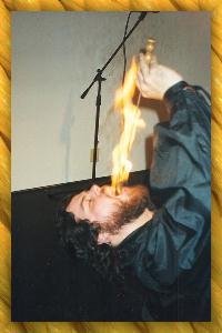 A photo of Sean K. Miller, the only professional Breaded Fire-Eater in America.
